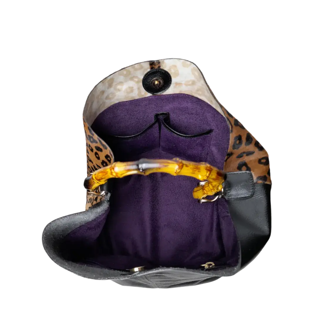 Claire Jaguar und schwarze Ledertasche für Damen