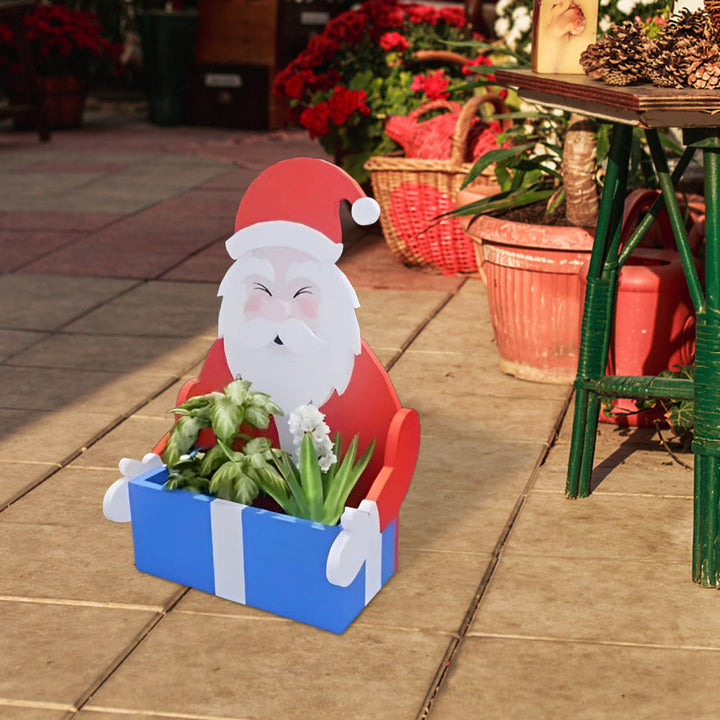 Blumentopf im Weihnachtsmann-Design