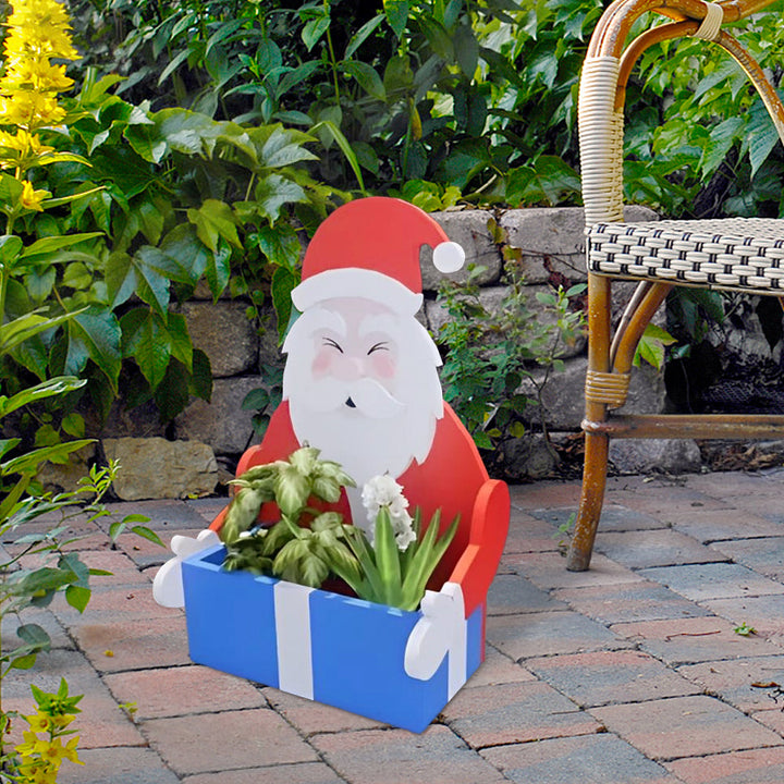 Blumentopf im Weihnachtsmann-Design