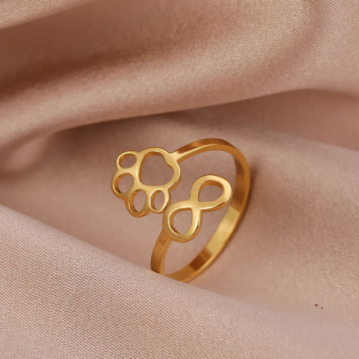 AYLA – Anello Infinity Verstellbarer in argento e oro"

 Riscritto: "AYLA – Anpassbarer Infinity-Pfotenring in argento e oro