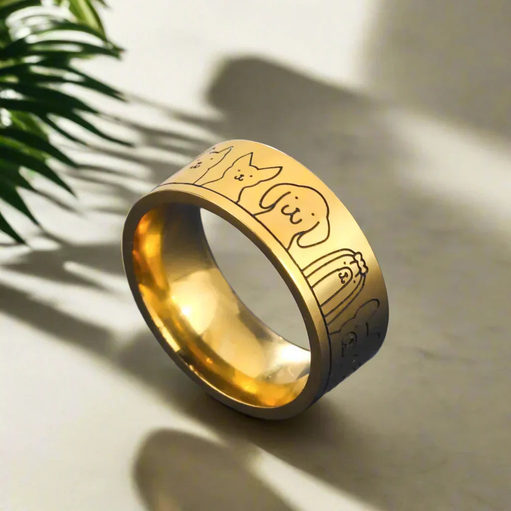 NIKA – Breiter Damenring aus Gold und Silber mit gravierter Pfote